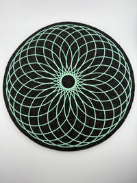 MoodMats Foam Torus 12" with green geometric design on a black background, featuring UV-reactive screen printing.
