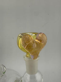 Handcrafted Lamp Dancer 14mm glass bowl piece with heart design and vibrant colors on a glass setup.
