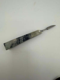 Stone Cold Creations 4" stone dab tool showcasing unique natural textures and elegant design for daily dabbing.