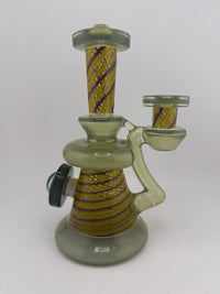 Bowman Glass X Vogel Glass Rettitube featuring vibrant striped design and unique shape, perfect for smoking.