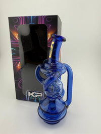 King Pluto Carta Top Tide Bringer in cobalt blue with stylish recycler design for smooth vapor hits.