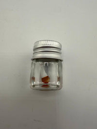 Lucky Gnome Glass Terp Pearl in a clear jar with a silver lid, showcasing unique mushroom design.