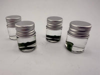 Lucky Gnome Glass Terp Pearl - Pickle in small jars, showcasing unique dab accessory for terp enthusiasts.