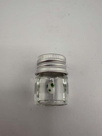Lucky Gnome Glass Terp Pearl - Yoshi Egg in clear jar with green dots, ideal for enhancing dab sessions.