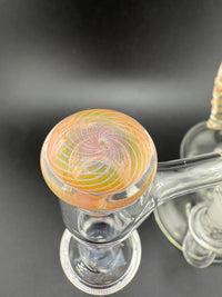 Close-up of Phatt Mat Glass Fumecello Terp Slurper Cap showcasing colorful swirl design for enhanced dabbing experience.
