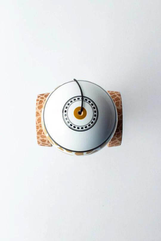 Top view of Sweets Kendama Reed Stark Gold Safari featuring unique giraffe print and design.