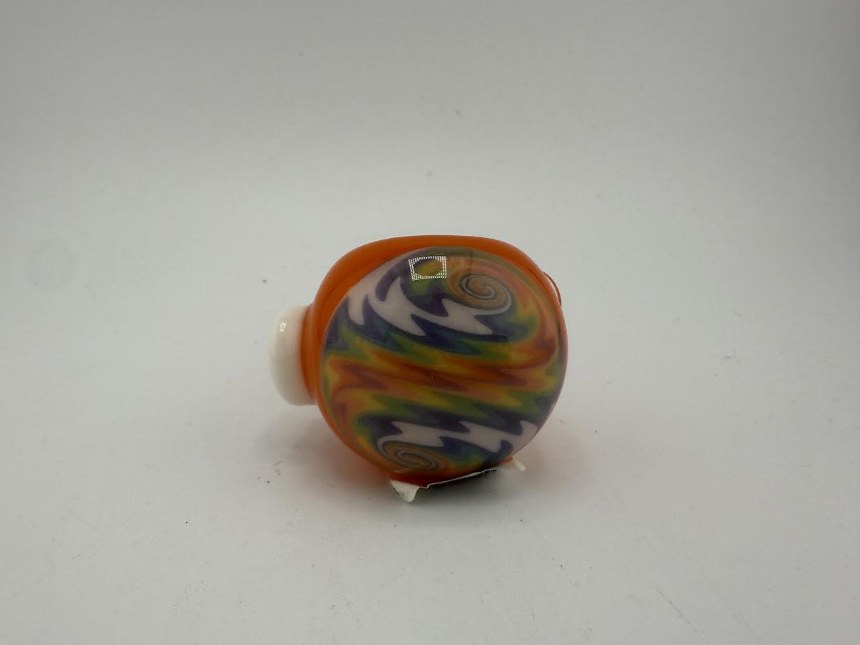 Mcdoogle Dry Pipe in orange and vibrant swirl design, showcasing its unique craftsmanship and colorful patterns.