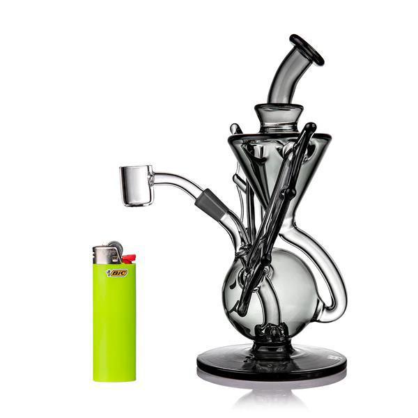 Nocturne Bat Rig COMING SOON - MJ Arsenal Mini Dab Rig with bat-inspired design and glow-in-the-dark features next to a lighter.