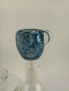 Close-up of Crondo Glass Frit 14mm bowl piece in blue color, showcasing unique texture and craftsmanship.