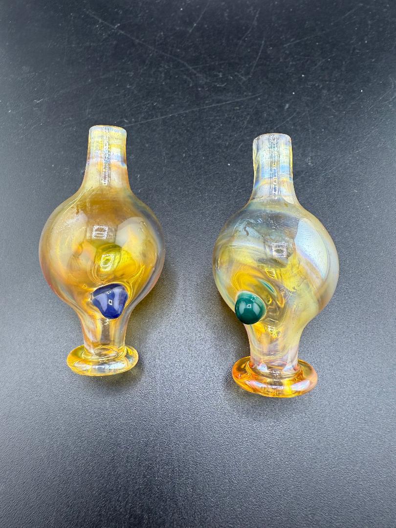 Filla John Fumed Bubble Cap set featuring vibrant color shifts and unique designs for enhanced dab experience.