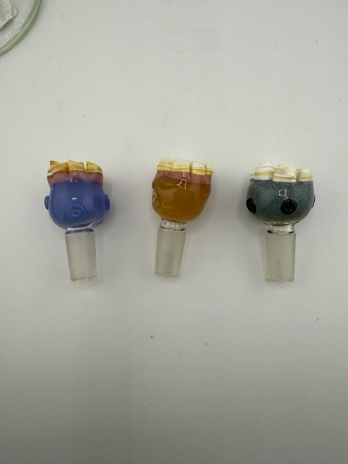 Three 14mm glass bowl pieces by Lamp Dancer featuring unique teeth designs in vibrant colors.