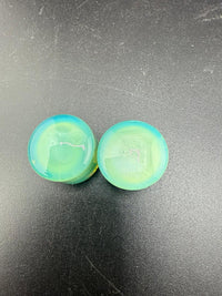 Handcrafted 3/4" Mop Head Glass Gauges in blue and green swirl design, showcasing bold artistry and premium craftsmanship.