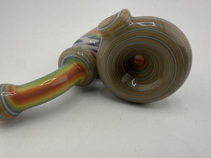 Close-up of a Mcdoogle Works Sherlock pipe featuring vibrant rainbow swirls and a smooth finish.