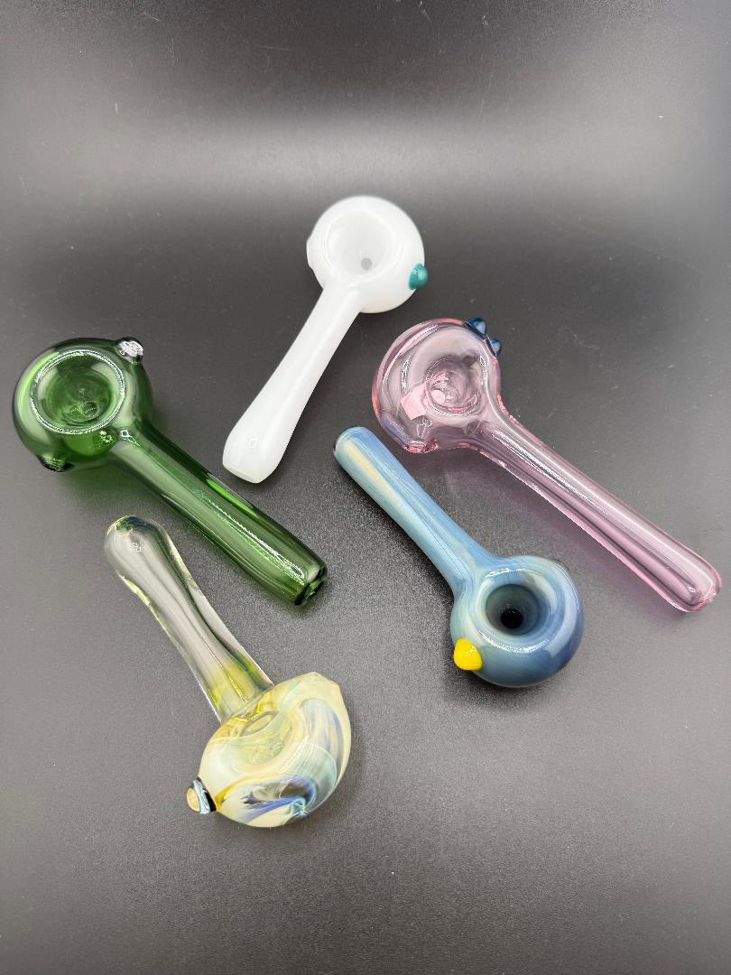 Filla John Glass Full Color Large Bowl Spoon Pipes in various colors on a black background.