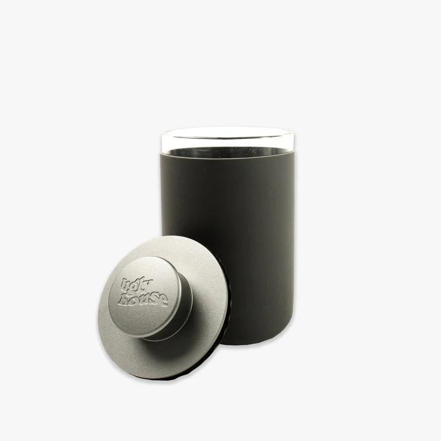 Ugly House Stash Air 9 oz black smell-proof storage container with airtight lid for herbs and snacks.