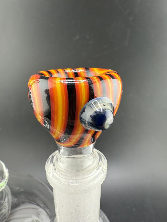 Colorful Filla John Glass Basic Wig Wag 14mm bowl with orange and black stripes, showcasing stylish wig wag design.