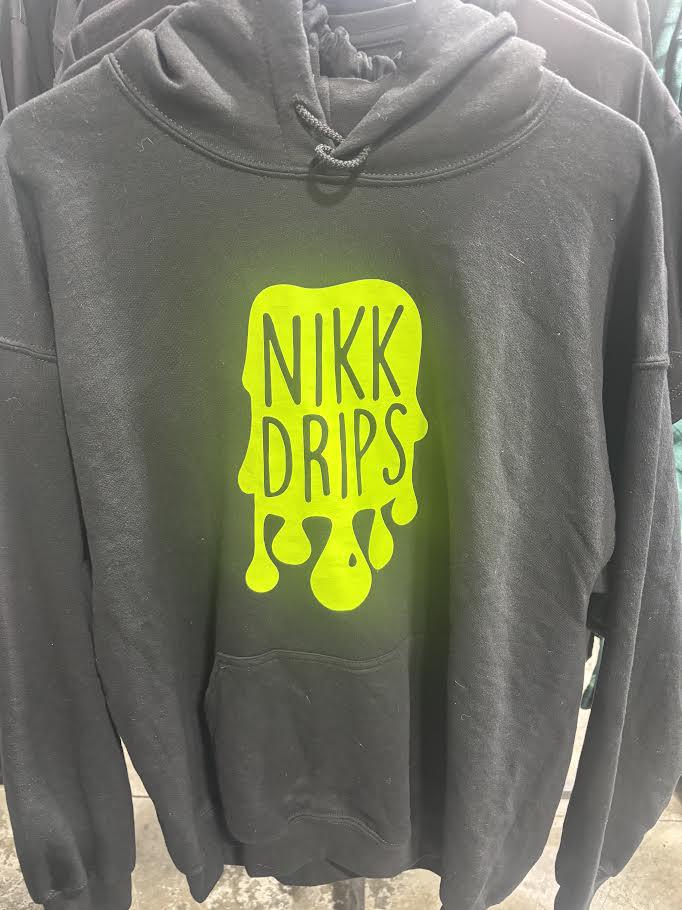 Nikk Drips Hoodie with Vinyl Logo displayed on a hanger, showcasing its unique design and vibrant colors.
