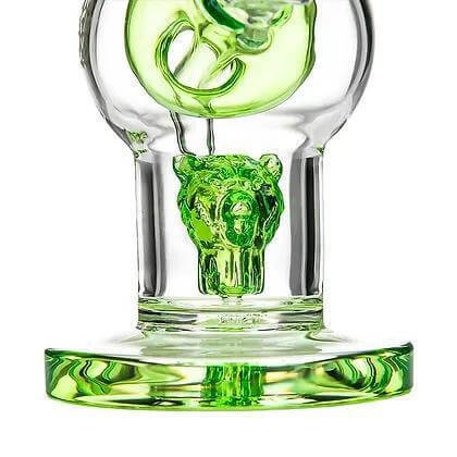 Close-up of Bear Quartz Sphere Kit glass piece featuring a bear design and vibrant green accents.