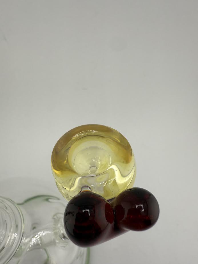 Top view of a handcrafted 14mm Lamp Dancer glass bowl piece showcasing unique yellow and dark red accents.