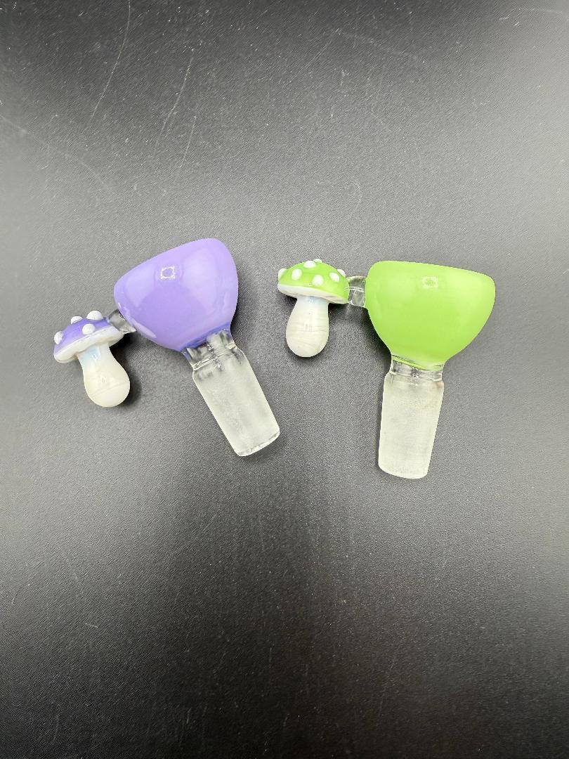 Mushroom 14mm bowls in purple and green, designed from durable borosilicate glass for a playful smoking experience.