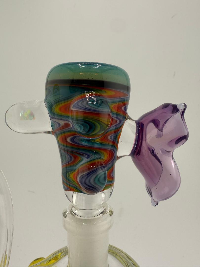 Highgrade Glass Spring Time Slide 14mm with vibrant colors and unique design for smooth smoking sessions.