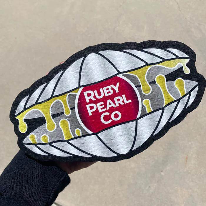 Ruby Pearl Co Mood Mat made from recycled wetsuits, 8.5in x 5in, featuring a unique design for eco-friendly decor.