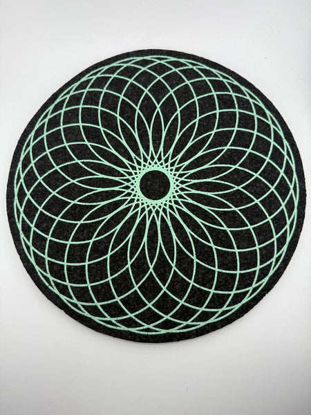 MoodMats Foam Torus 12" with green geometric design on a black background, featuring UV-reactive screen printing.