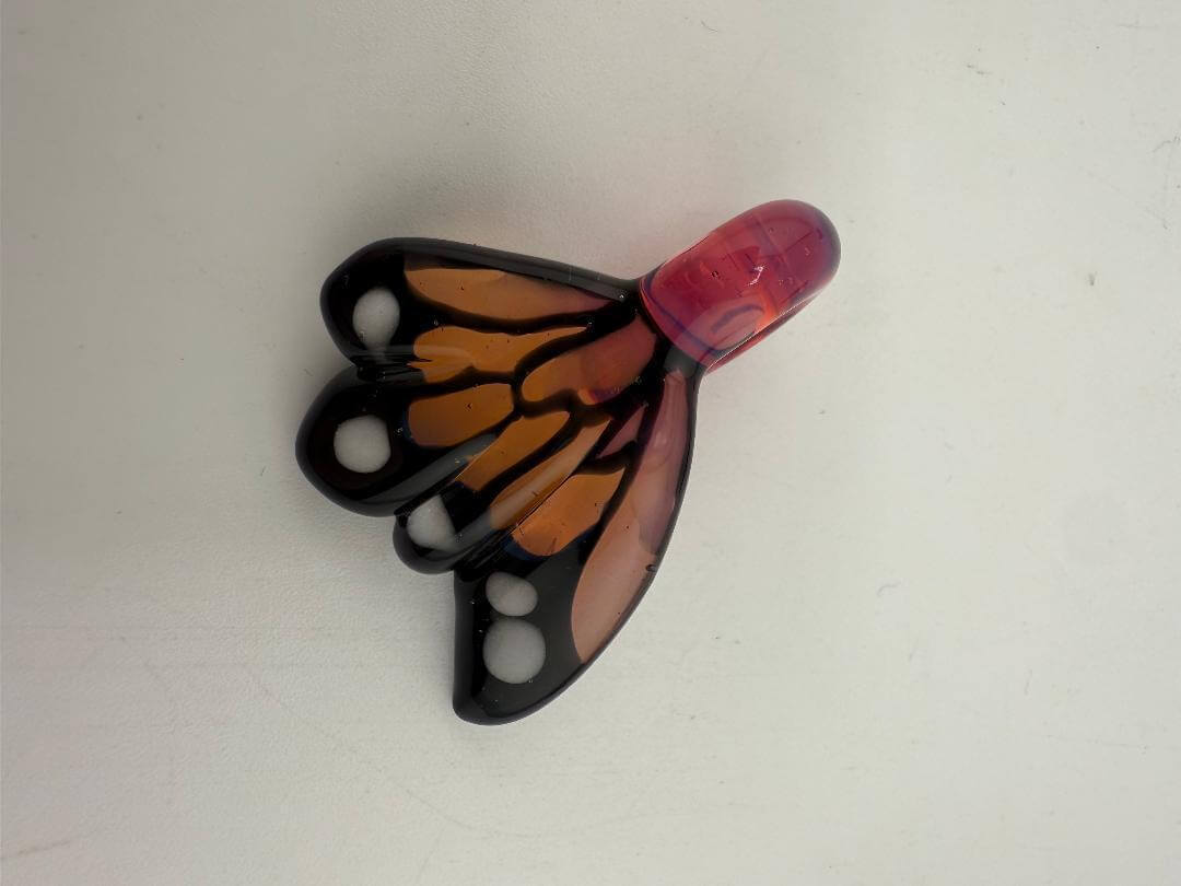 Windstar Monarch Pendant featuring butterfly wing design in black and orange, perfect for unique jewelry collections.