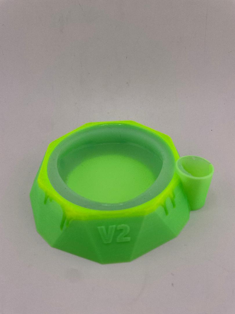Focus V Carta 2 base stabilizer in lime green color with Saber Hot Knife Holder for convenient dab station setup.