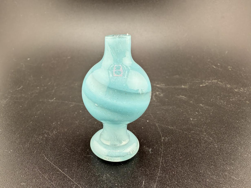 Bolt Up Bubble Cap in aqua color with swirled design, perfect for enhancing the smoking experience.