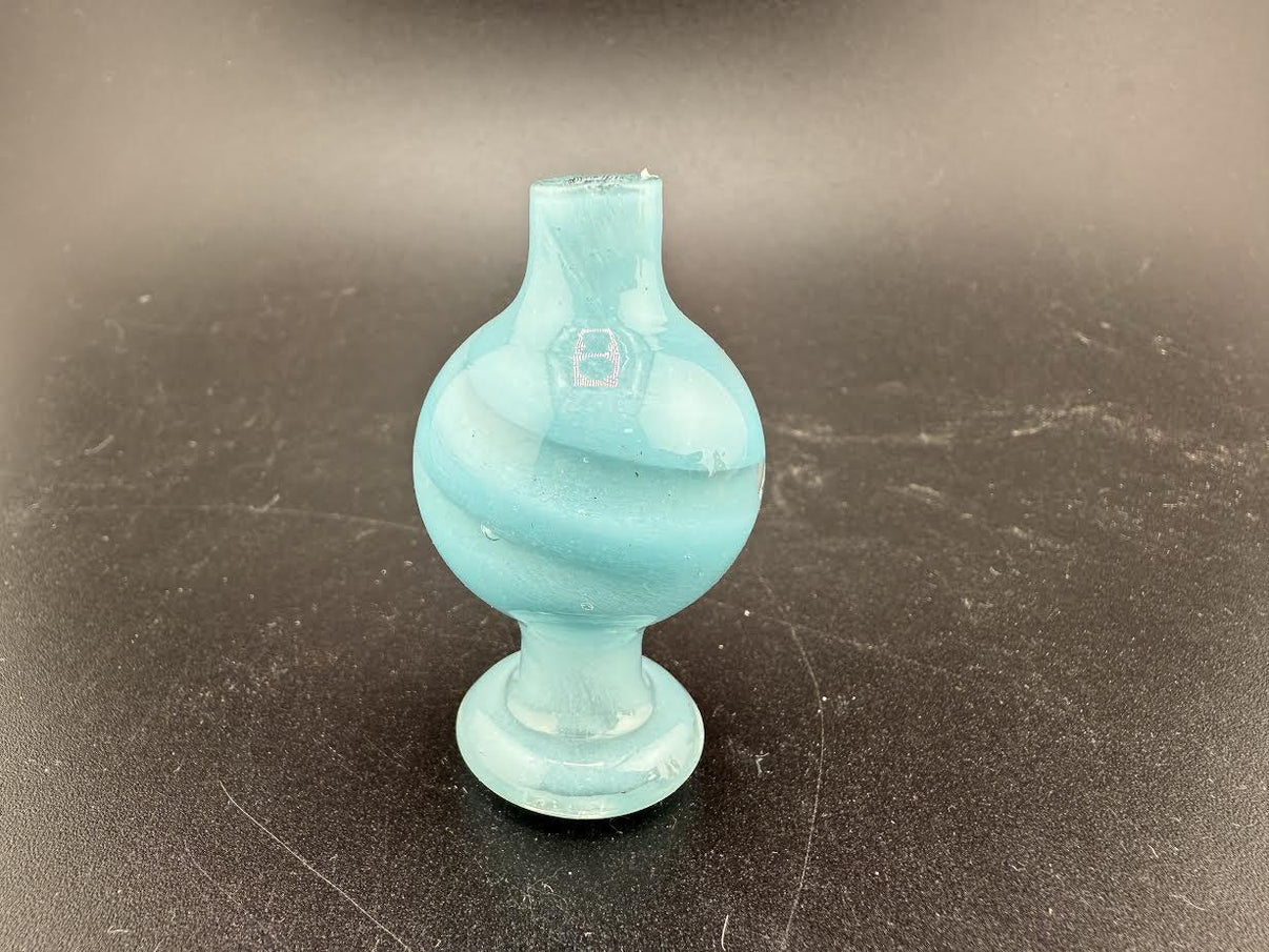 Bolt Up Bubble Cap in aqua color with swirled design, perfect for enhancing the smoking experience.
