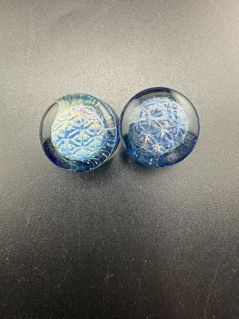 Handcrafted Mop Head Glass Gauges in blue, showcasing intricate swirl texture and unique design for stretched ears.