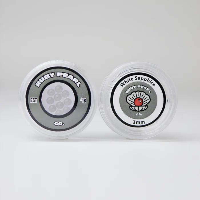 Ruby Pearl Co containers showcasing Clear and White Sapphire terp pearls for optimal dabbing performance.