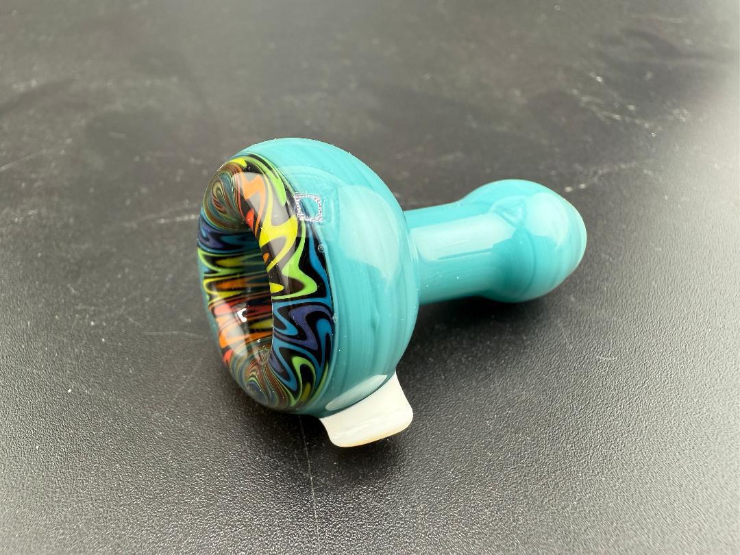 Handcrafted Mcdoogle Glass Chillum in turquoise with vibrant swirls, showcasing artisan glasswork from Spokane, WA.