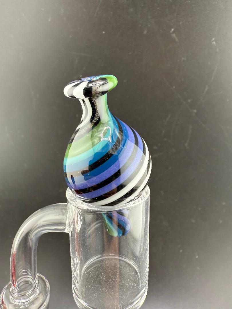 Filla John Line Worked Bubble Cap with vibrant blue and green stripes, enhancing dabbing efficiency and style.