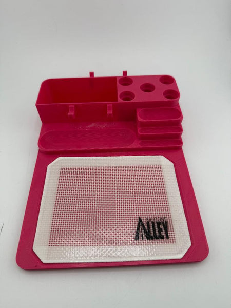 Nikk Drips 3D Printed Dab Station in pink with silicone slick work area and tool slots.