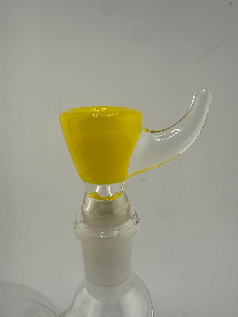 Close-up of a glass bowl with a yellow horn handle, designed for a 14mm setup, showcasing vibrant color and unique design.
