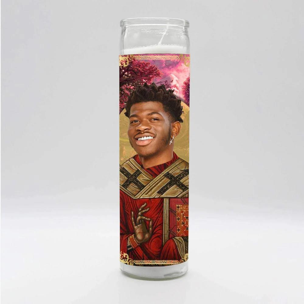 Tall white Bobbyk Saint Candles featuring a parody-inspired image of a cultural icon, ideal for home decor.