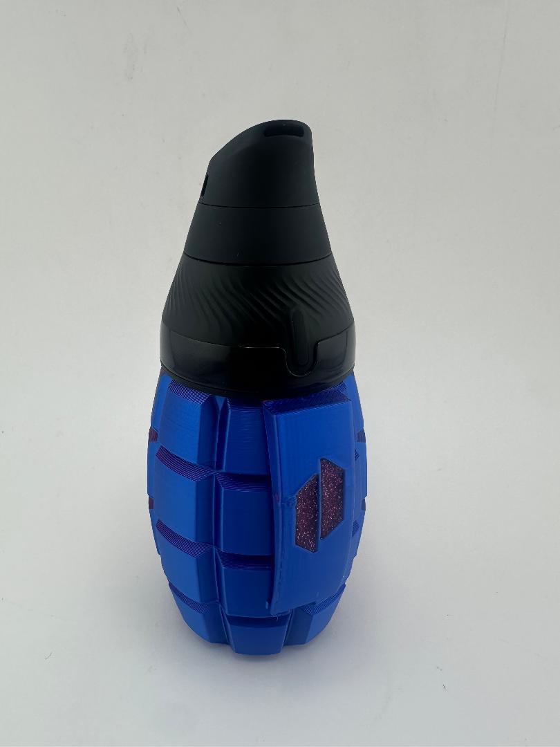 Puffco Proxy Core Grenade Cup in blue and black, resembling a tactical grenade for enhanced grip and style.