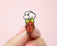 Cute enamel pin featuring a whimsical design of a flower and a figure, by Little Woman Goods Enamel Pins.