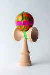 Sweets Kendama Mini Lava Lamp with vibrant orange and green ball, designed for easy tricks and portability.