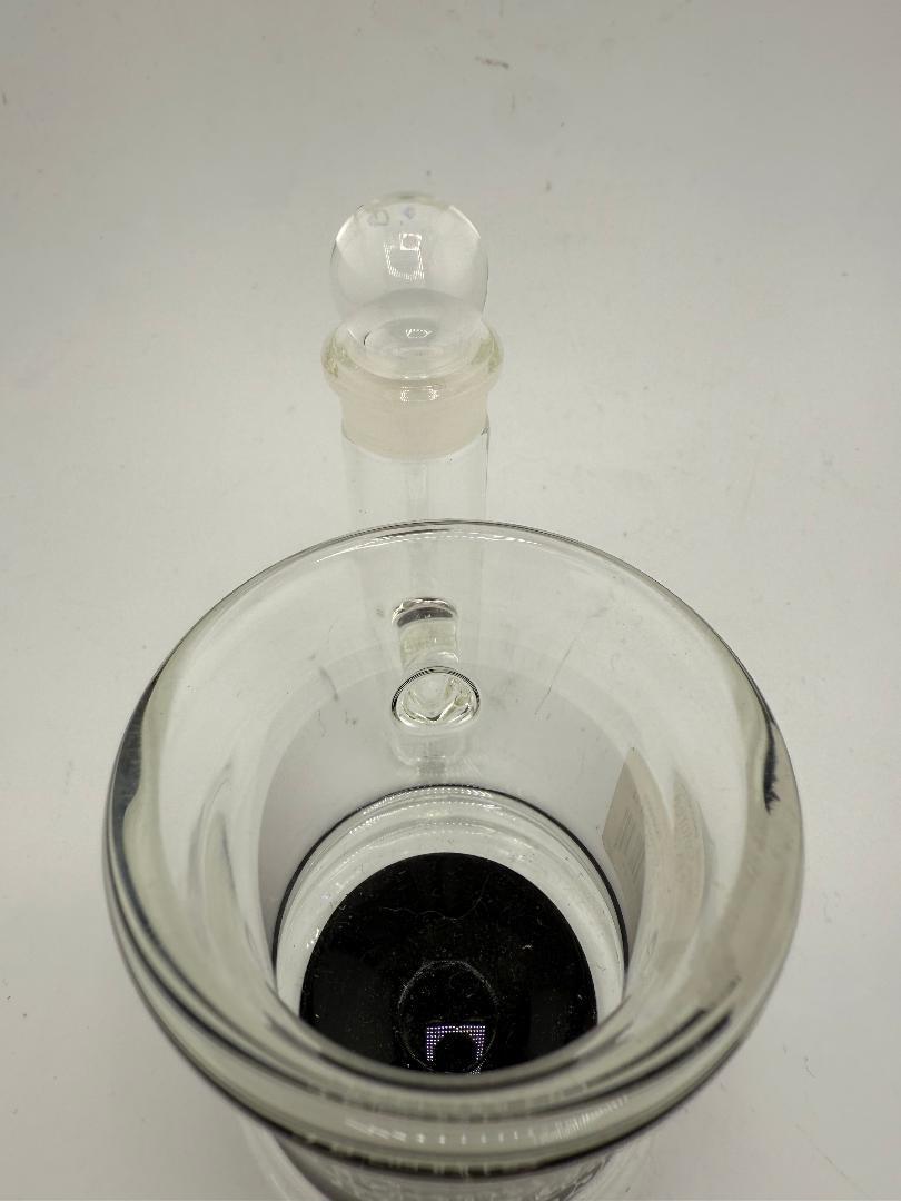 Close-up view of a home blown glass colored Q-Tip ISO jar showcasing its handcrafted design and durability.