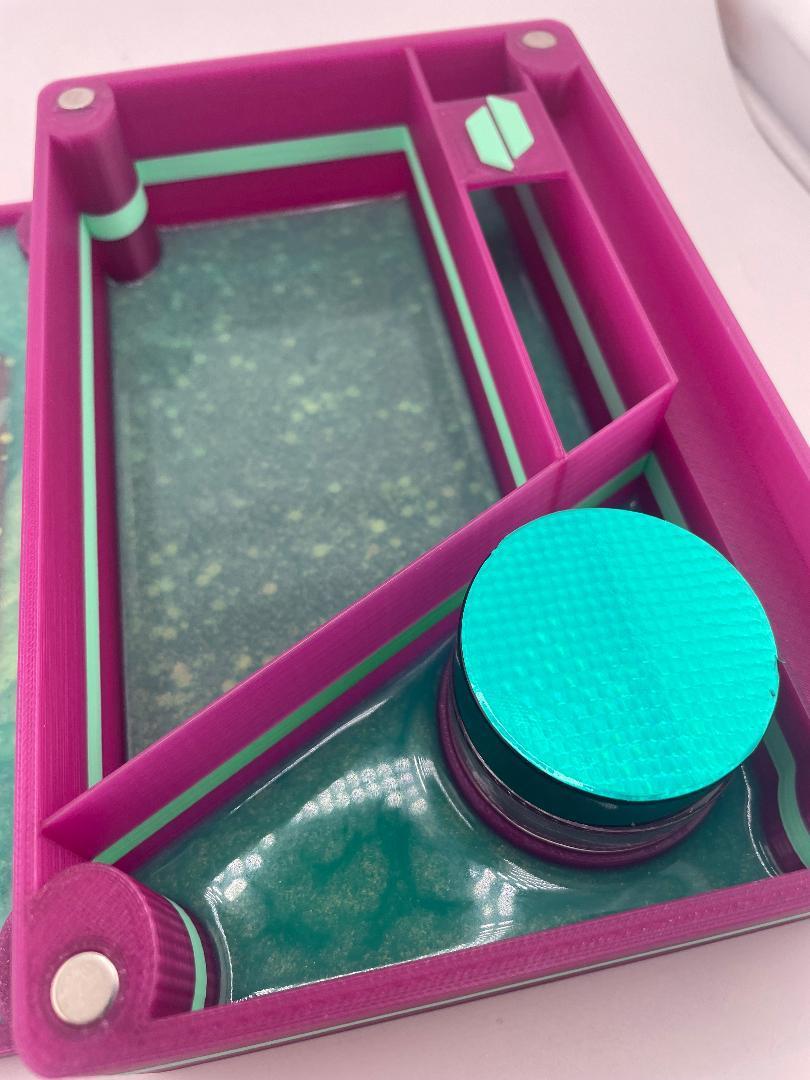 Close-up of Kandy Custom 3-D Prints Puffco Proxy storage box showcasing purple and teal design with storage compartments.