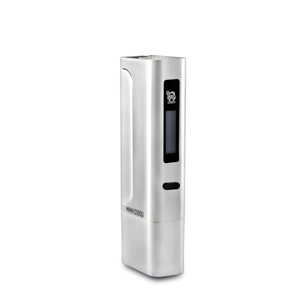 Huni Badger Portable Device Pro in silver with digital display, designed for quick heating of herbal extracts.