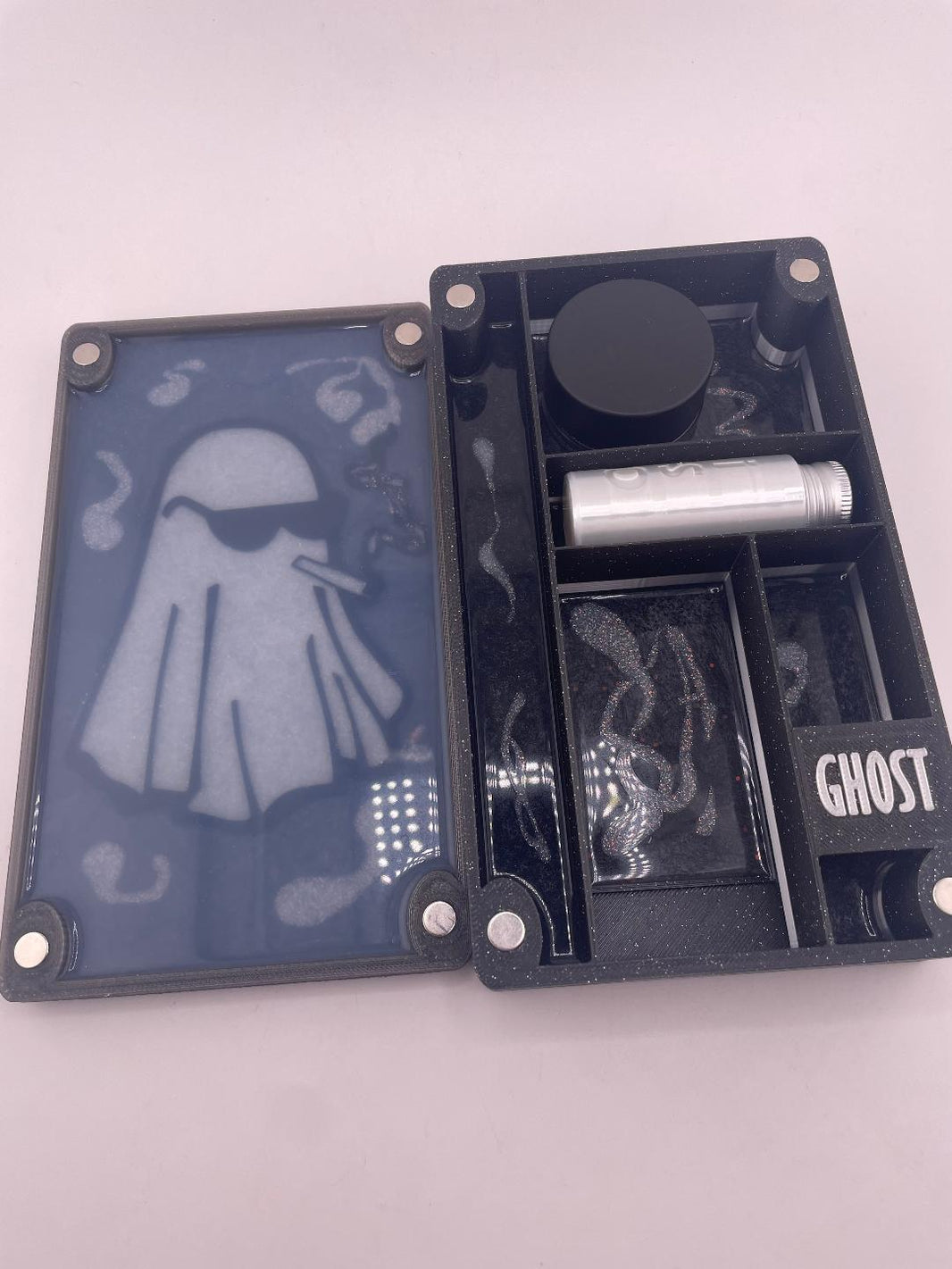 Dr Dabber Ghost 2 storage box with ghost design, ISO jar, and silicone lid, organized for essentials.