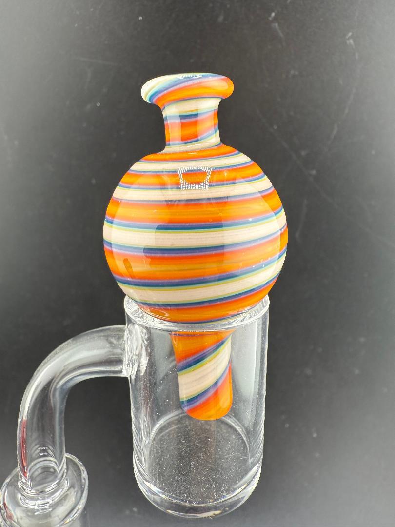 Filla John Line Worked Bubble Cap with vibrant orange and multi-colored line work design for enhanced airflow.