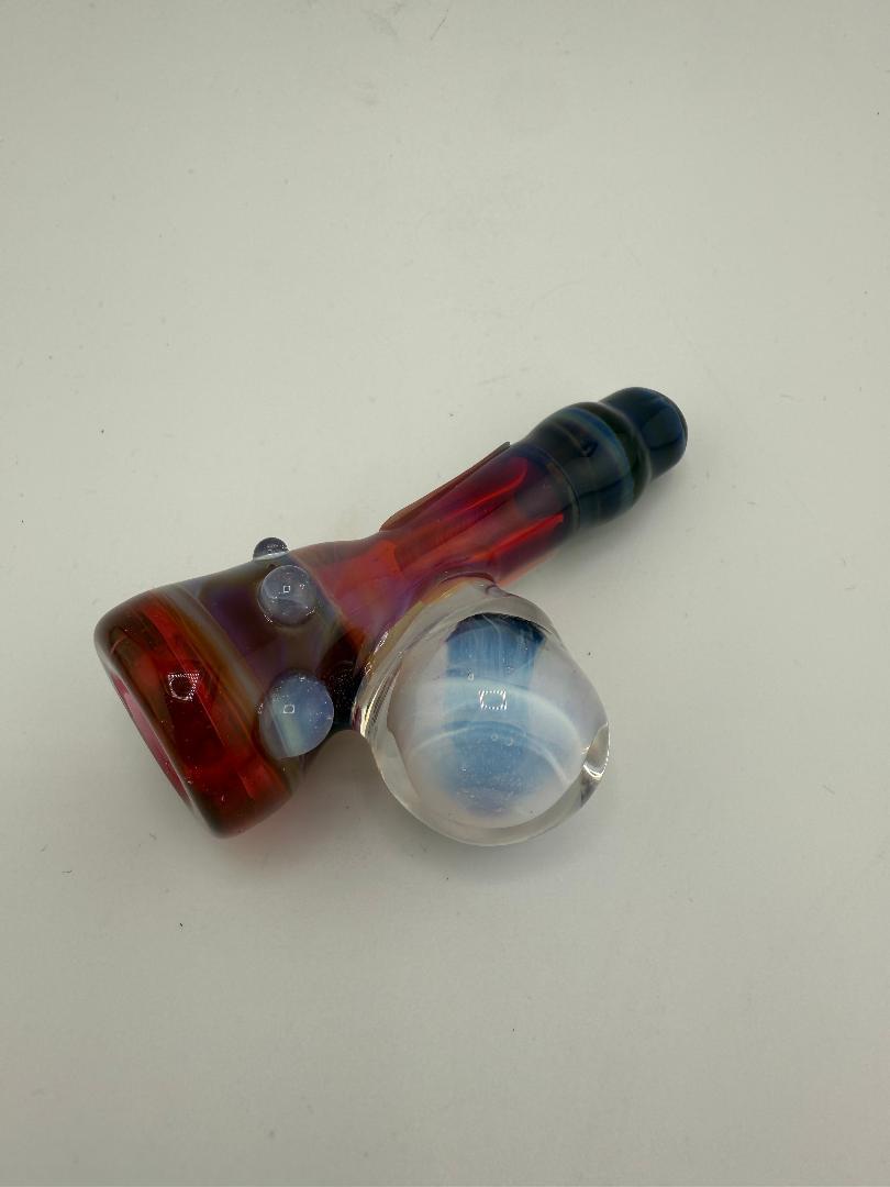 Handcrafted Tuck Glass Pink & Blue One-Hitter Pipe from Spokane, featuring vibrant colors and compact design.