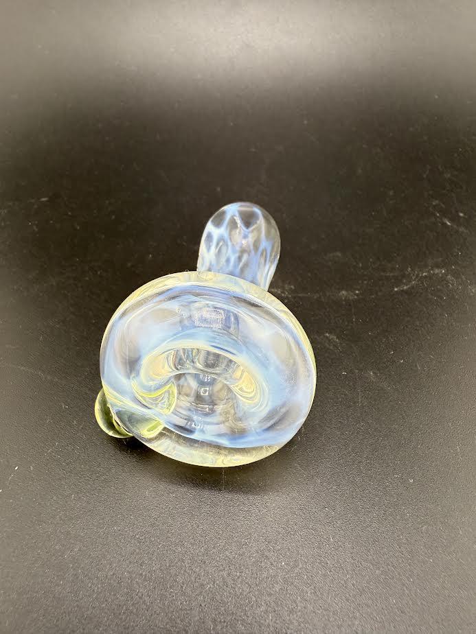 Mcdoogle Dry Spoon featuring a translucent, swirling design on a black background.