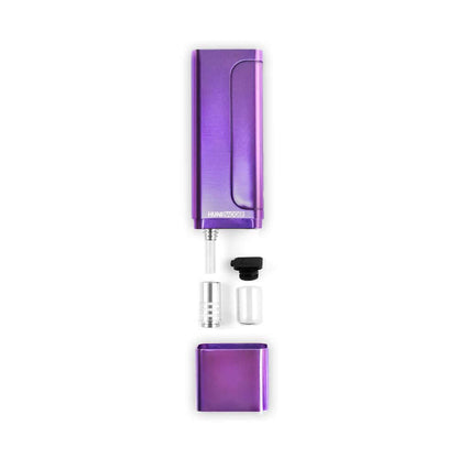 Huni Badger portable device in purple with accessories, showcasing its compact design for easy herbal extraction consumption.
