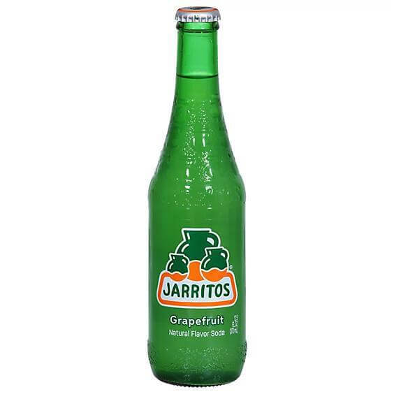 Jarritos Grapefruit Soda 16oz bottle showcasing natural flavors and refreshing taste.